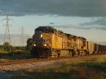 UP 5962 leads Weston coal loads at Ryan Road under a post-storm sky